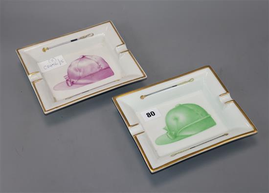 Hermes Paris. A pair of jockey cap and whip porcelain cigar ashtrays